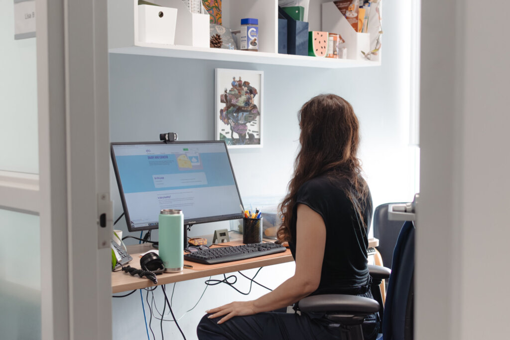 A person looks at a computer.