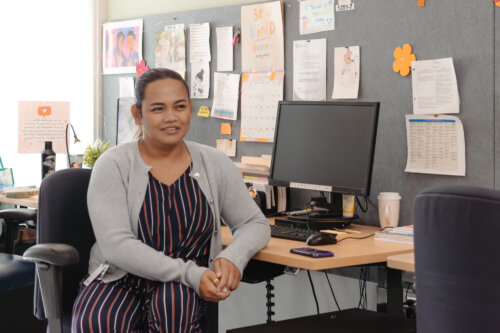 A nurse by a computer.