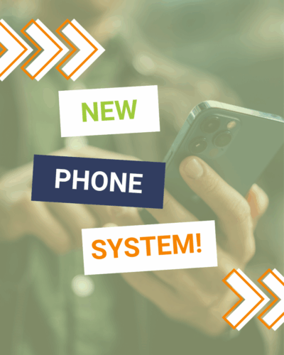 Background photo of a hand on a phone with the text New Phone System!